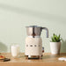 EAN 8017709316075 - Smeg MFF11CREU espumador o calentador de leche Calentador/espumador de leche automático Crema de color imagen 10